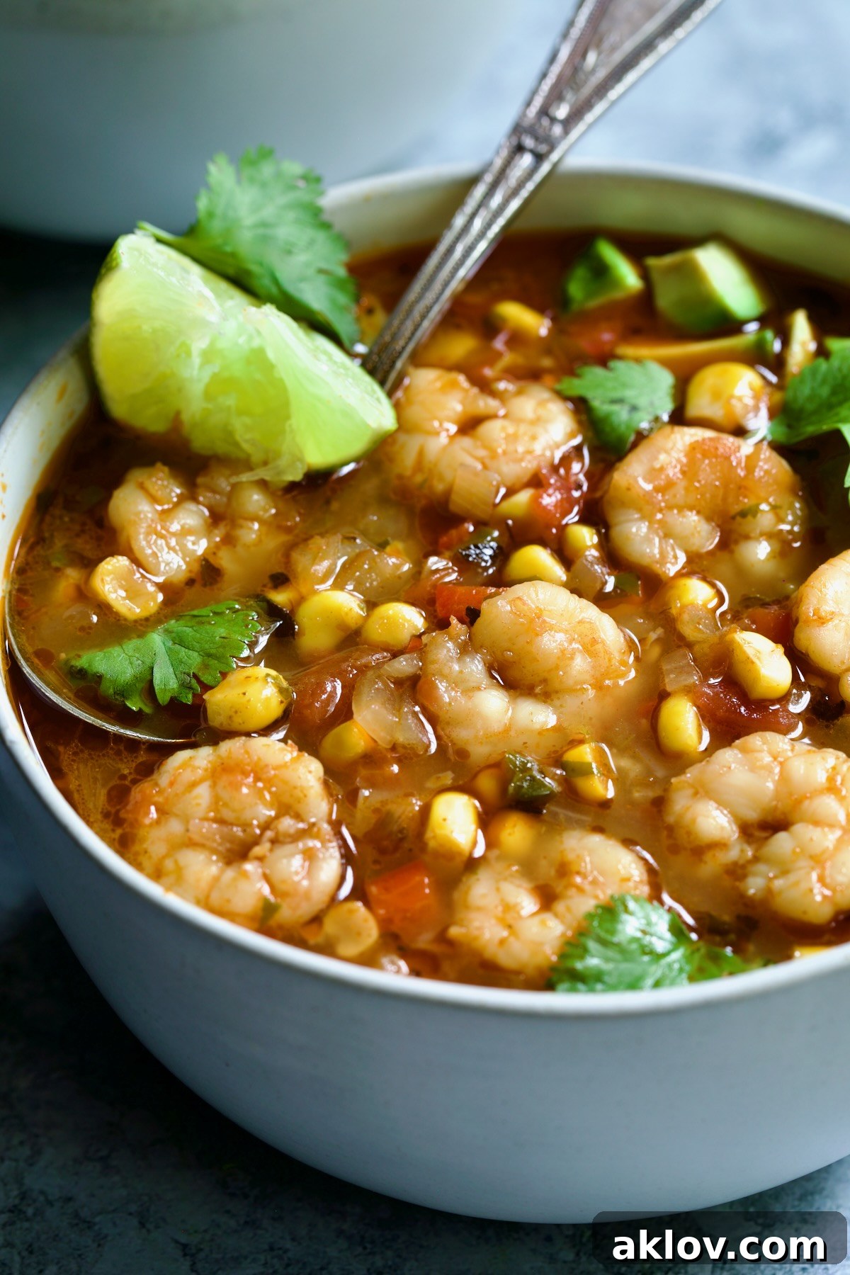 A close-up shot of the savory Shrimp and Corn Soup, featuring tender shrimp, bright corn, and a rich broth, ready to be served.