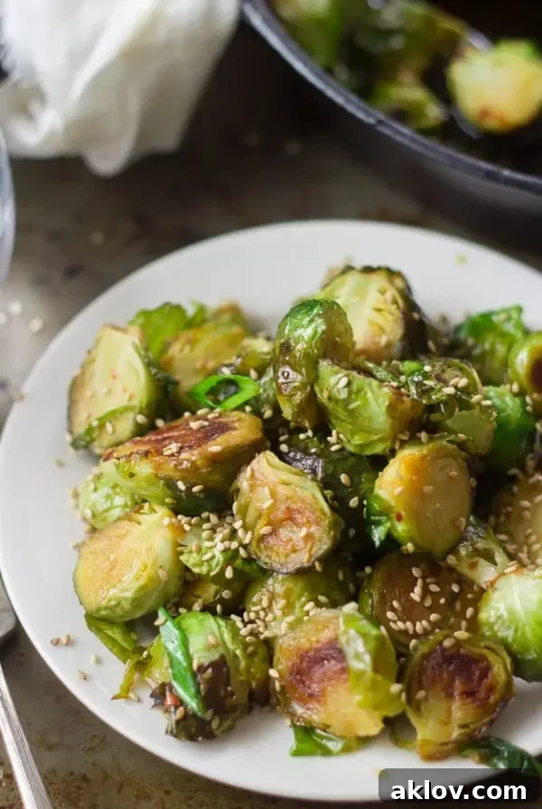 Sweet and Sour Brussels Sprouts, coated in a glossy sauce.
