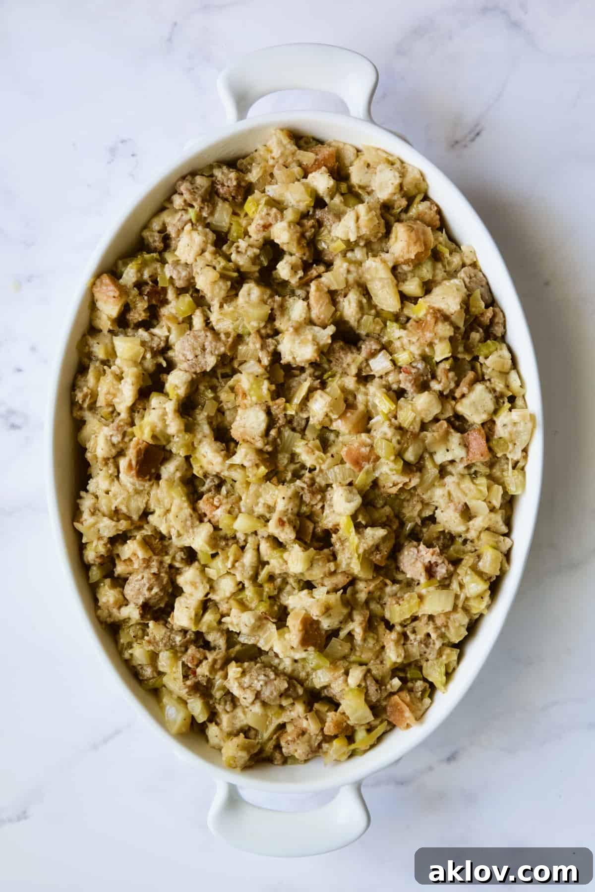 Aromatic Fennel and Leek Sausage Stuffing 12 Unbaked Sausage Stuffing with Fennel and Leeks in a baking dish, ready for the oven.
