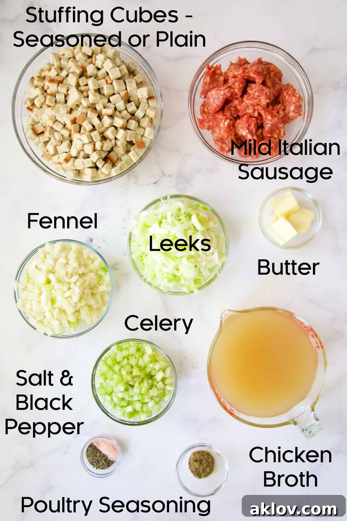 Assortment of fresh ingredients for Sausage Stuffing with Fennel and Leeks, arranged in glass bowls on a kitchen counter.