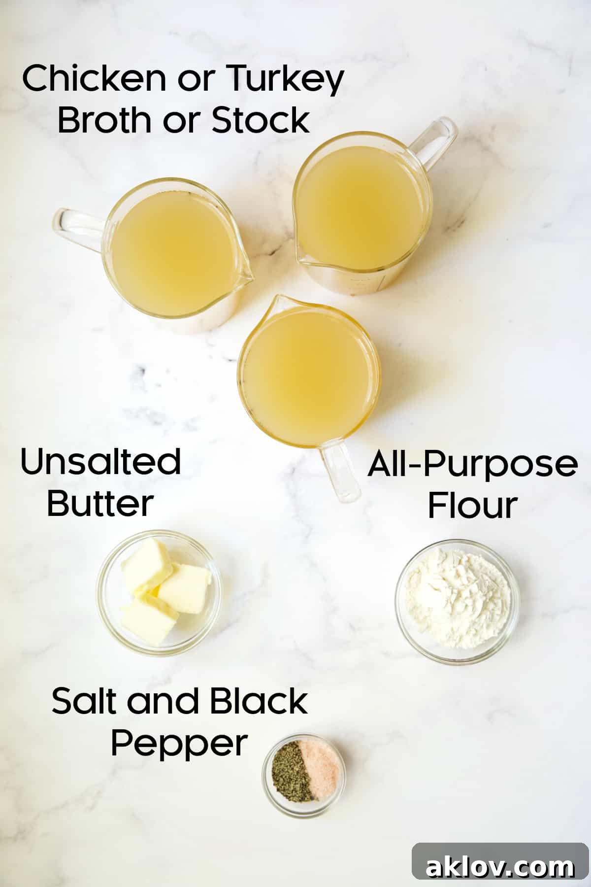 All the fresh and high-quality ingredients laid out to make gravy without drippings, including broth, butter, flour, and seasonings.