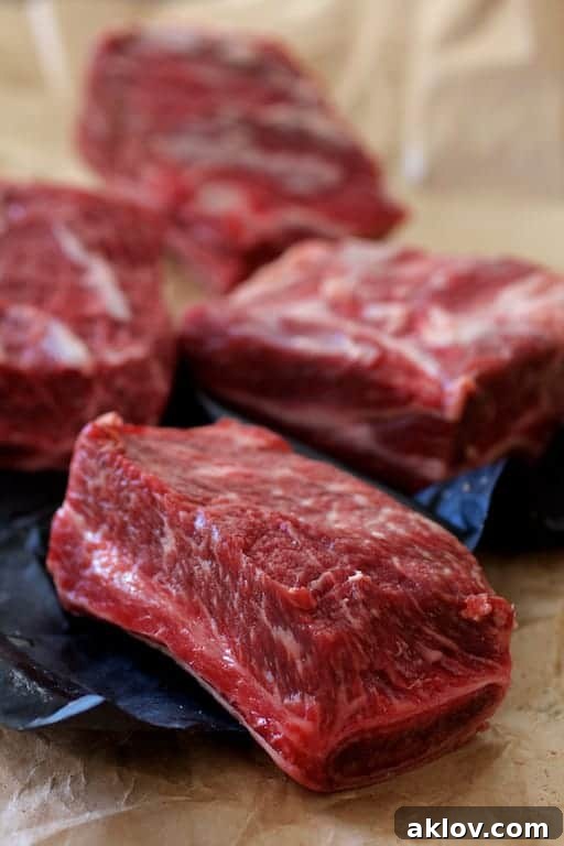 Photo of uncooked beef short ribs on the bone.