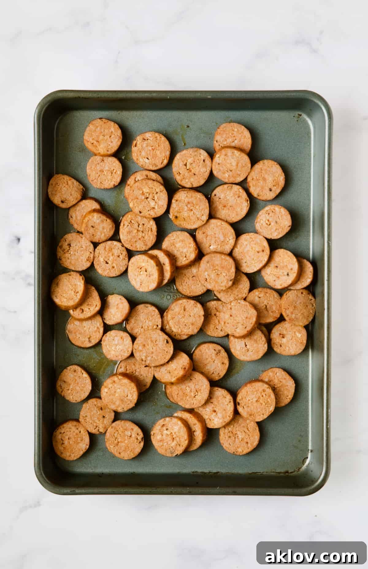 Chorizo slices on baking sheet.