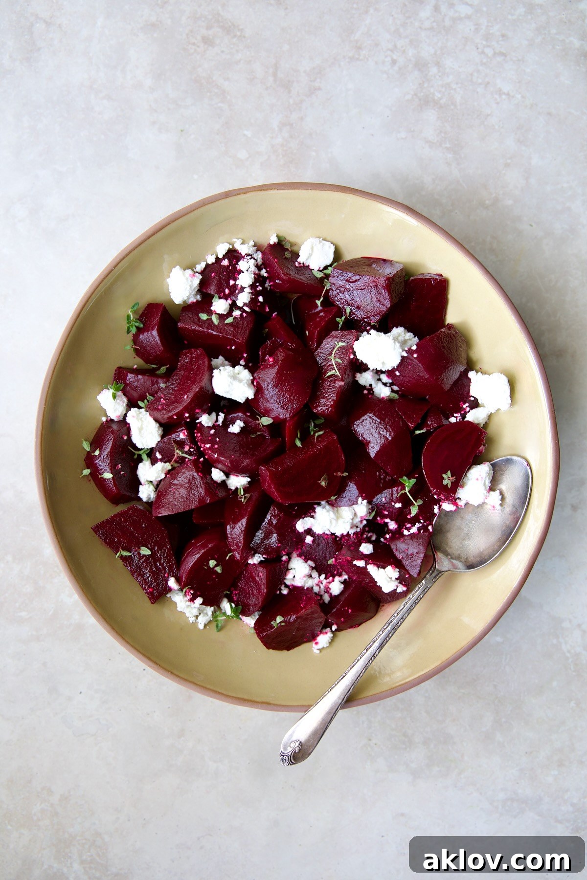 An elegant presentation of roasted beets with red wine glaze and goat cheese, invitingly served.