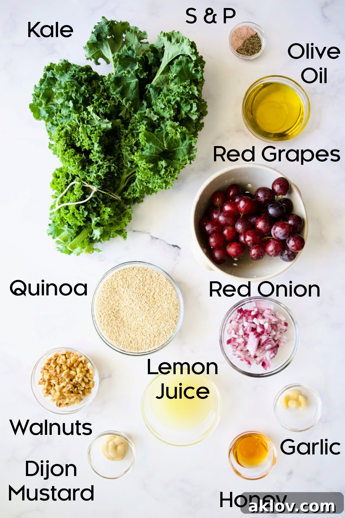 A collection of fresh ingredients for Kale Quinoa Salad with Lemon Honey Dressing, neatly arranged in glass bowls on a kitchen counter.