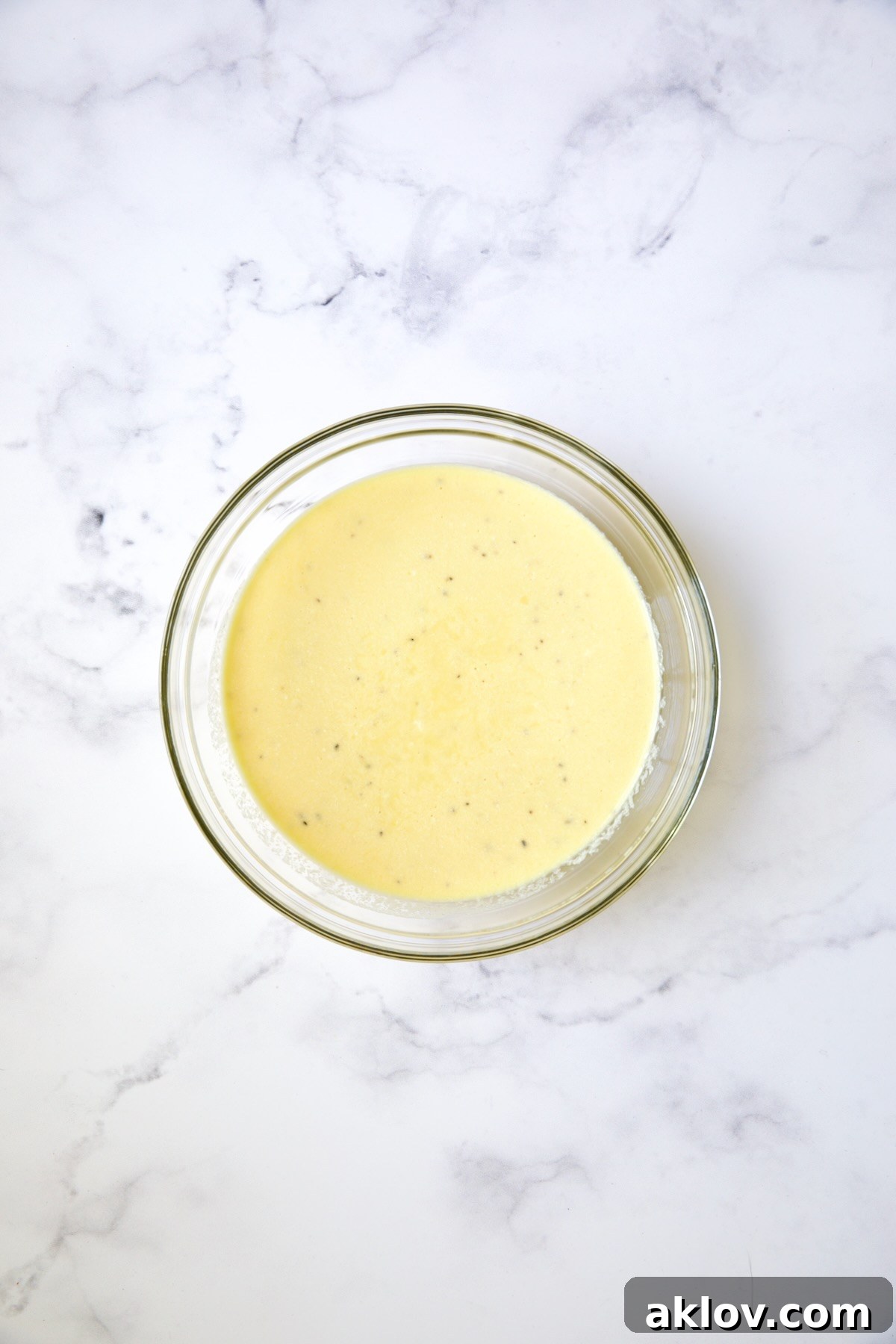 Custard for sheet pan puff pastry tart in glass bowl.