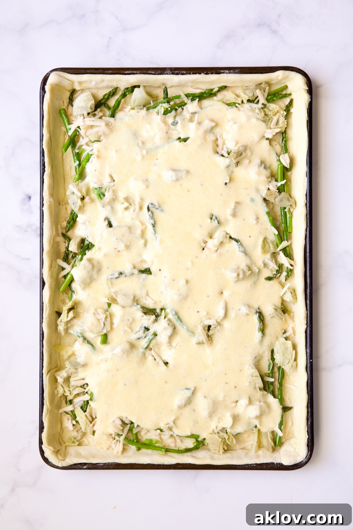 Puff pastry tart after custard is added and before goat cheese is added.