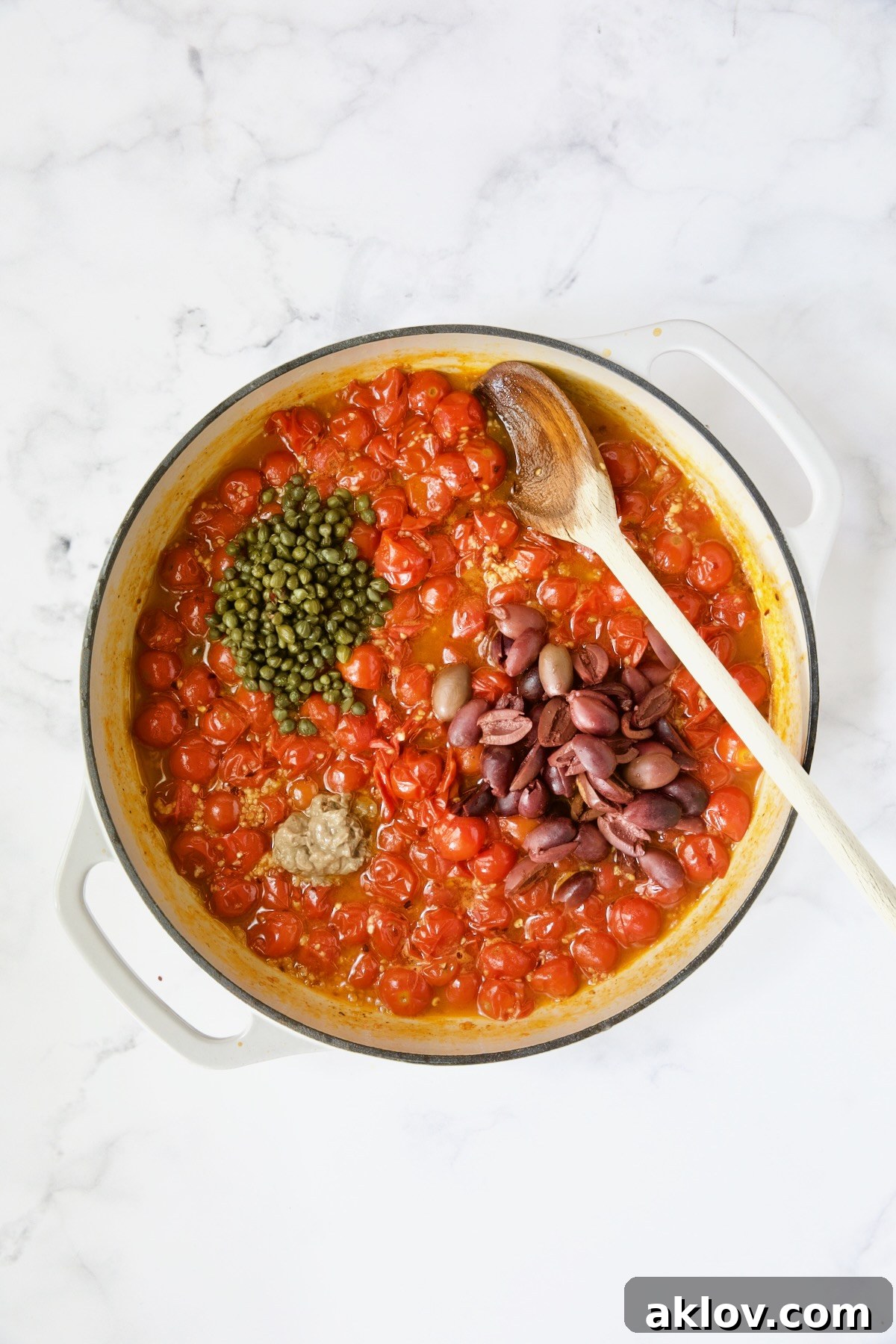Cherry tomato sauce with capers, anchovy paste and Kalamata olives added.