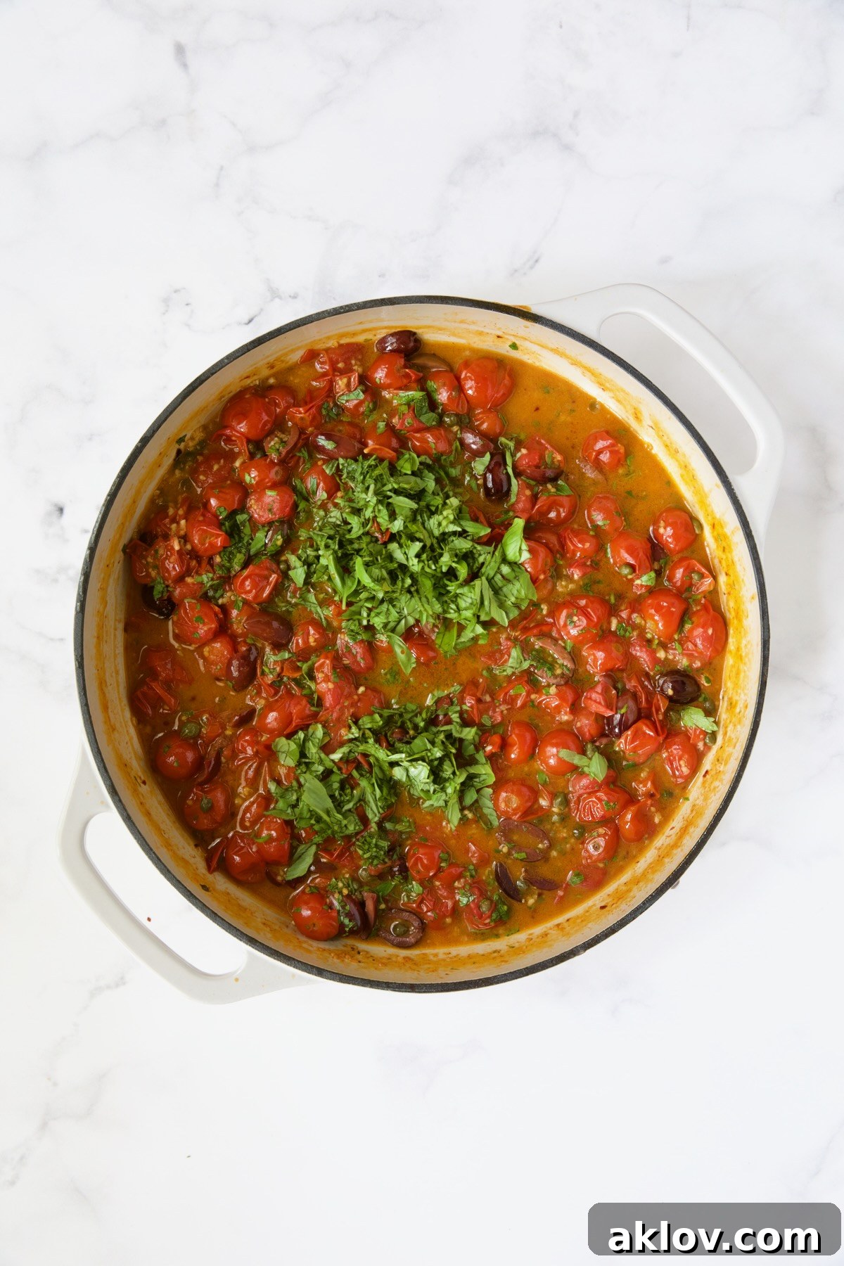 Cherry tomato puttanesca sauce with the fresh herbs added.