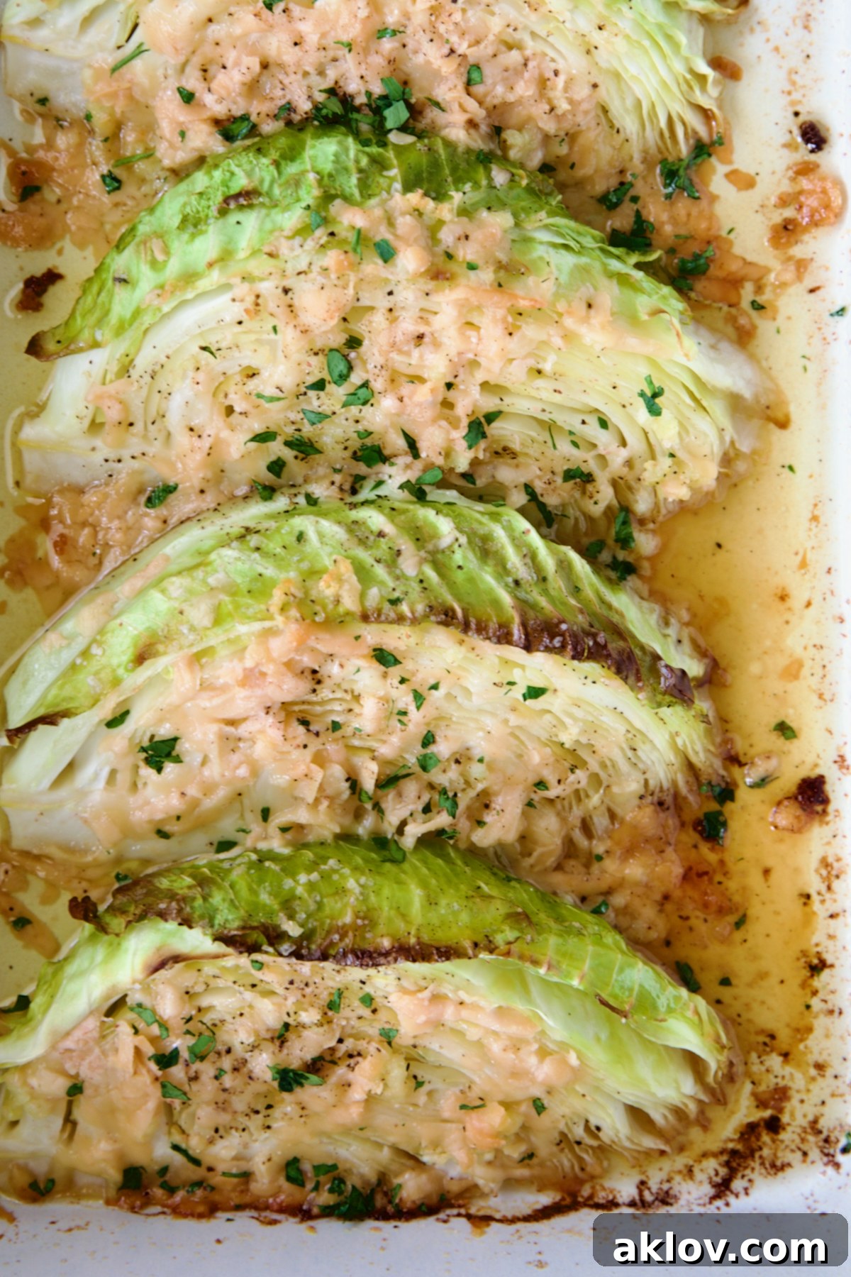 Three wedges of Baked Garlic Parmesan Cabbage Wedges.