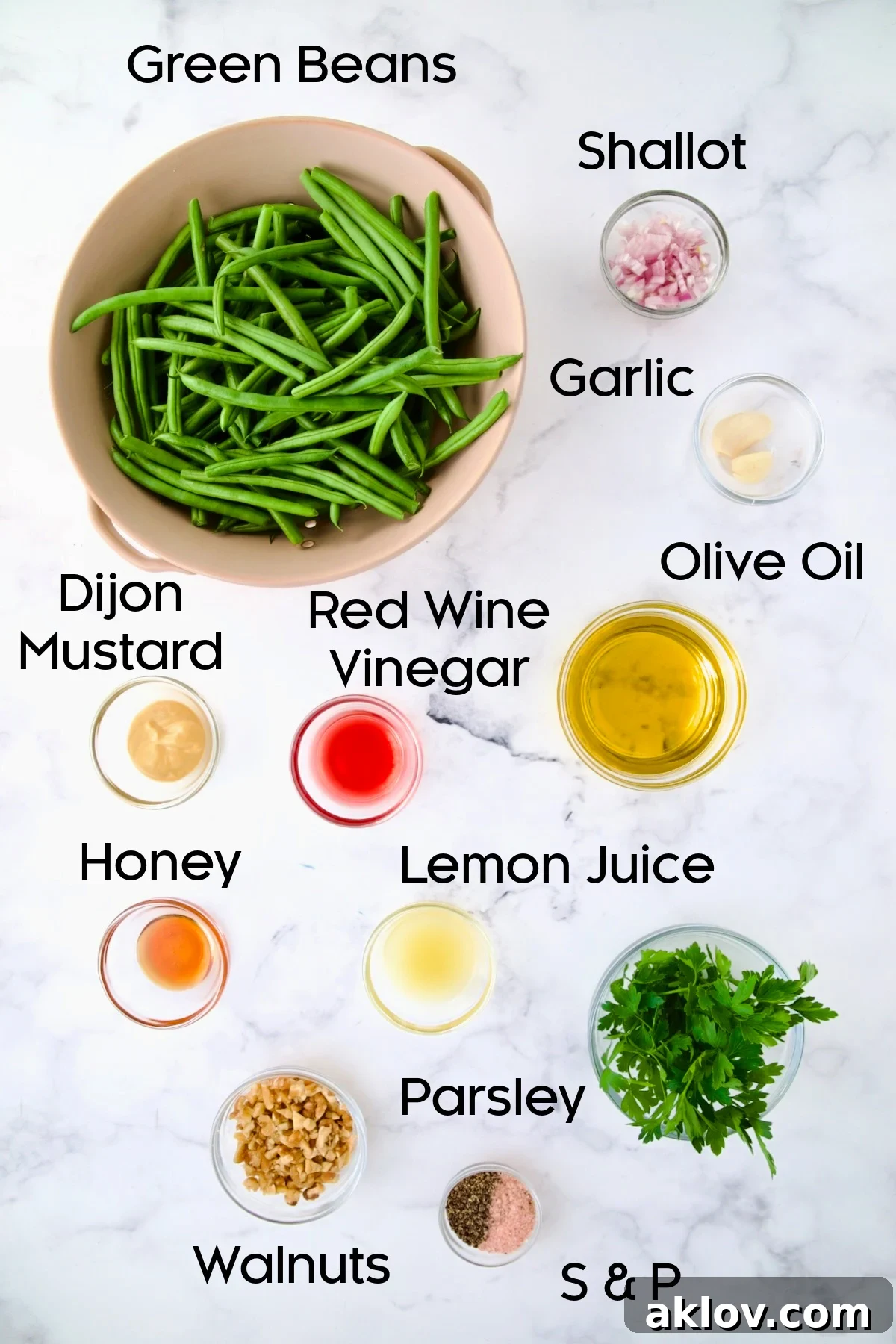 Ingredients for Green Bean Salad with Mustard Vinaigrette in glass bowls.