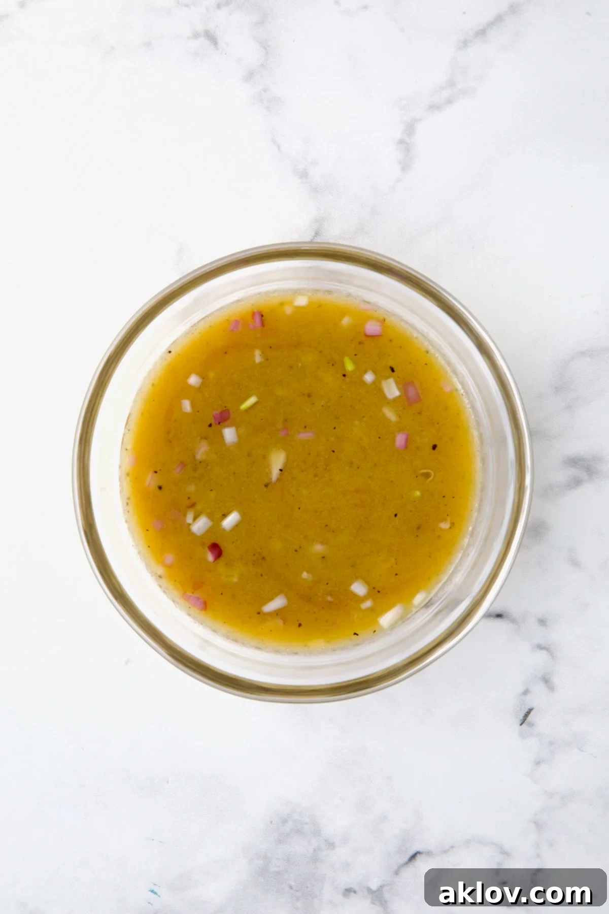 Mustard vinaigrette in glass bowl.