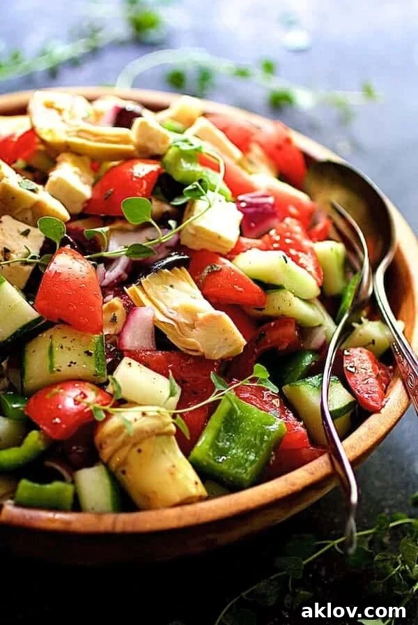 Greek Vegetable Salad served in a rustic wooden bowl, ready for enjoyment.