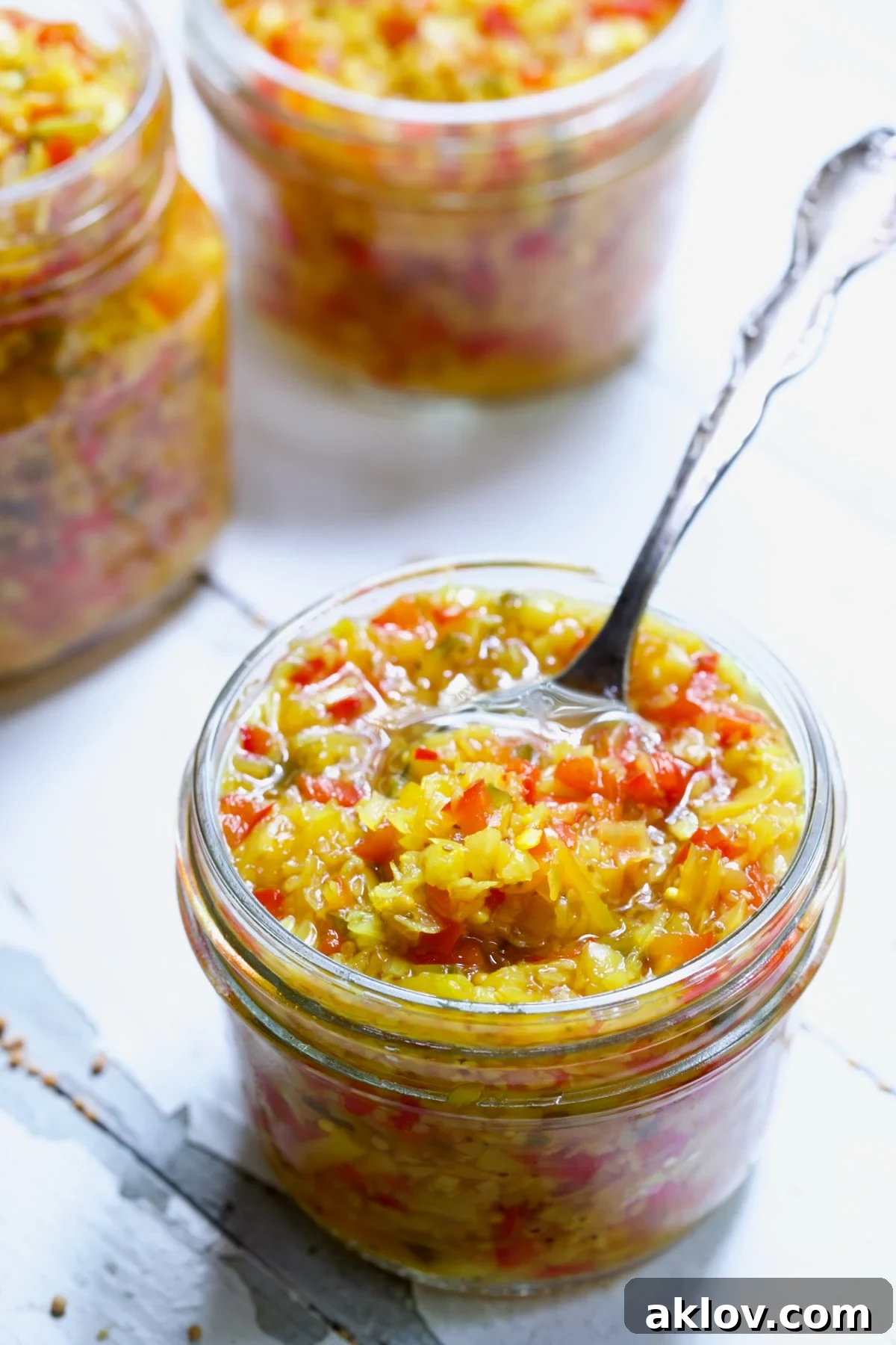 Fiery Ramp Relish 11 A jar of Ramp and Pepper Relish with a spoon, inviting a taste.