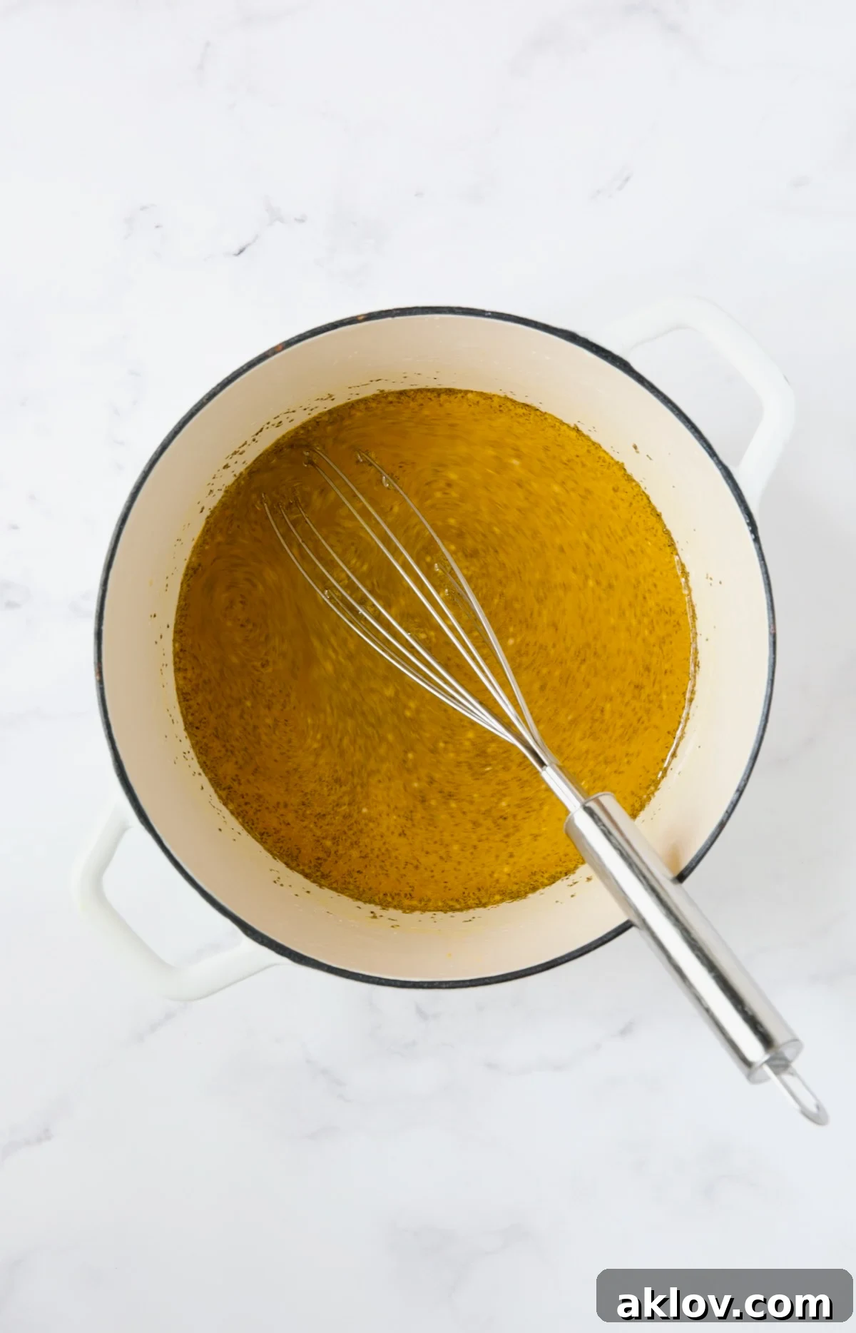 Fiery Ramp Relish 7 Ingredients for the pickling brine simmering in a white Dutch oven.