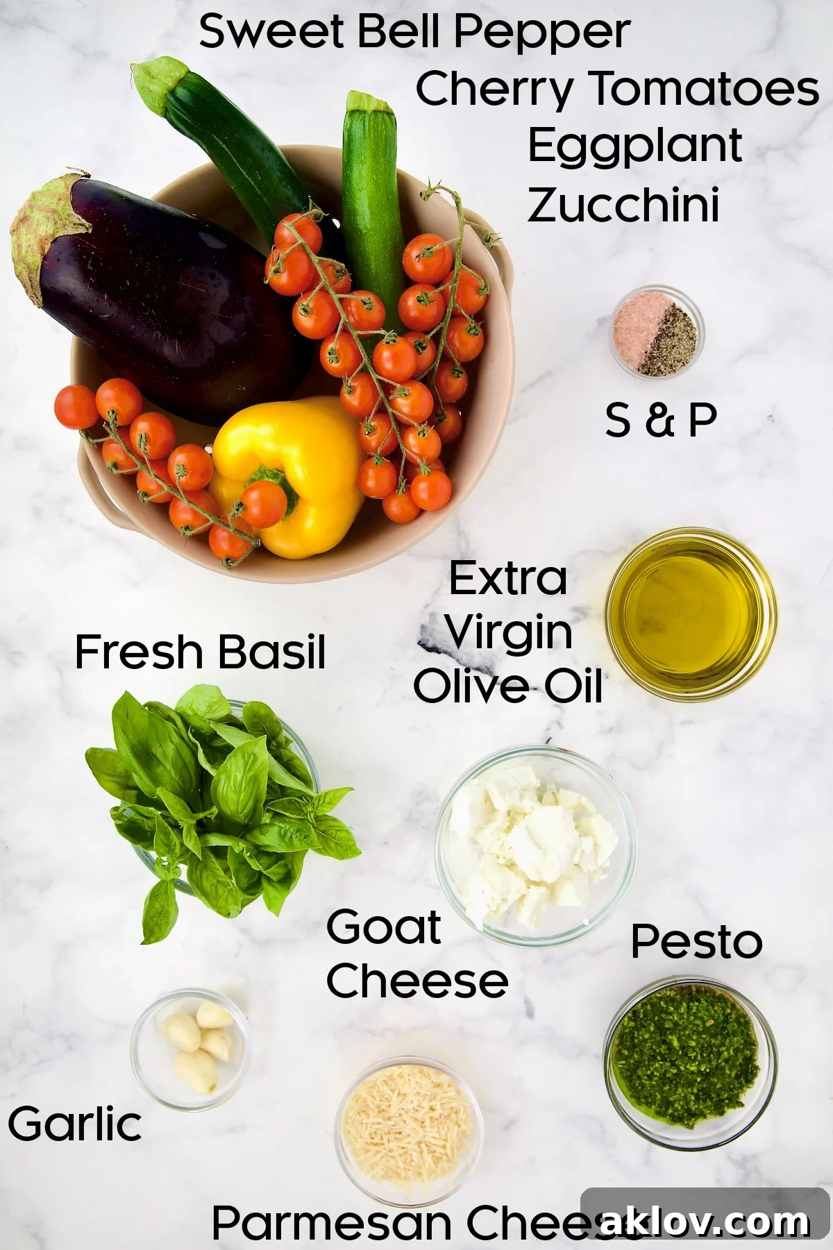 A vibrant selection of fresh ingredients for the Mediterranean Vegetable Galette filling, including cherry tomatoes, zucchini, bell pepper, garlic, basil, and goat cheese.