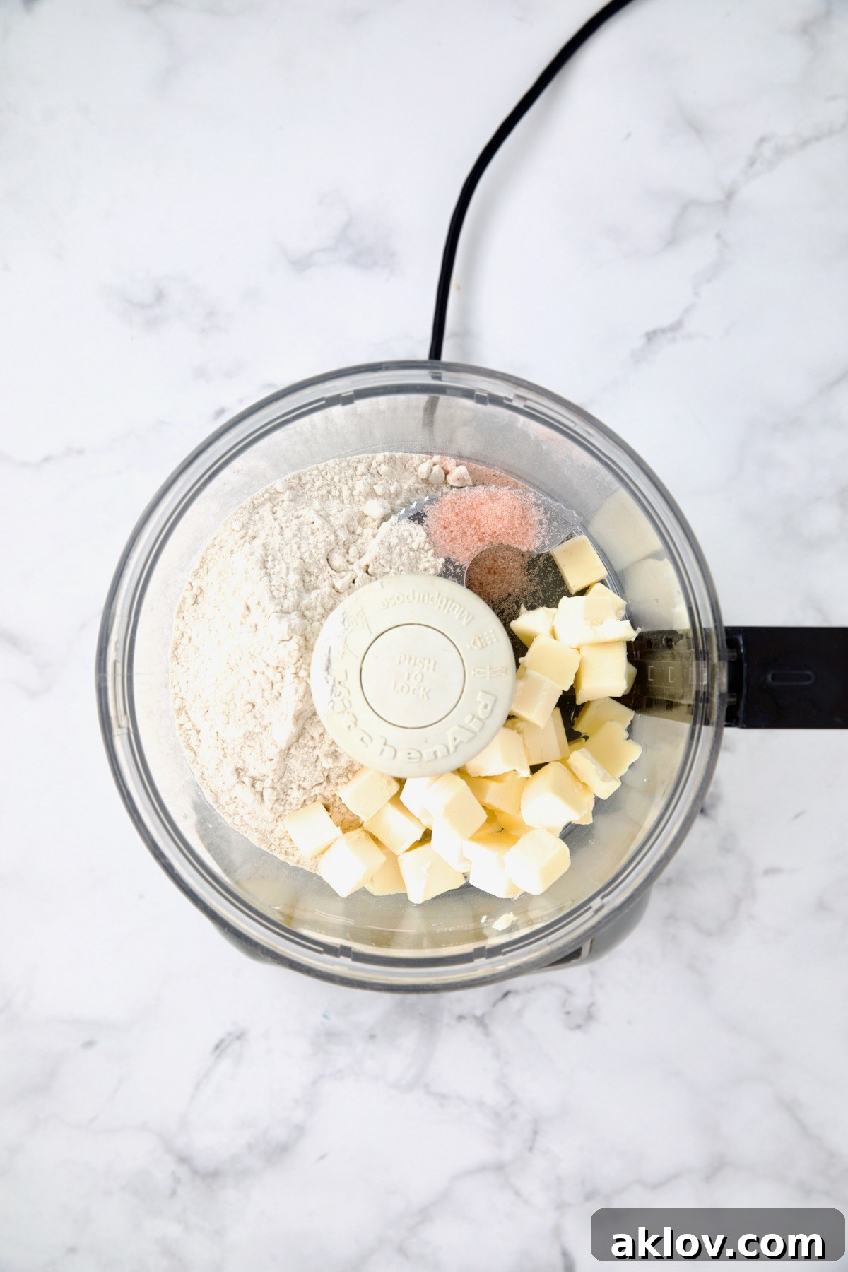 Ingredients for galette pastry in food processor before being combined.