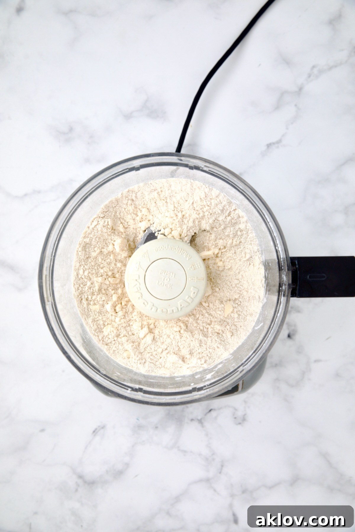 Ingredients for galette dough in food processor after being combined.