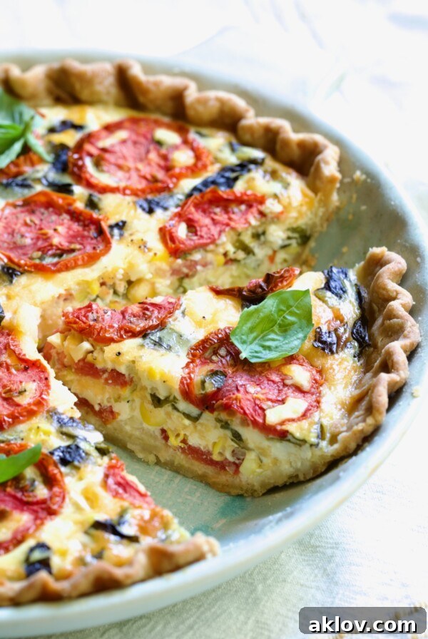 Tomato Pie Recipe with Corn and Basil with the focus on one piece.