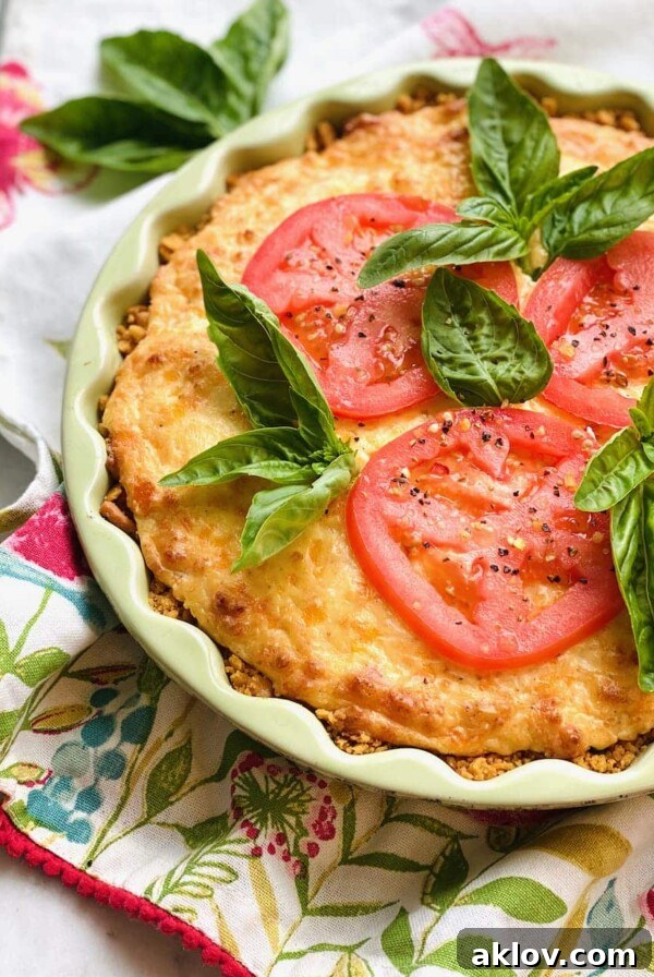 Southern Tomato Pie garnished with fresh basil.
