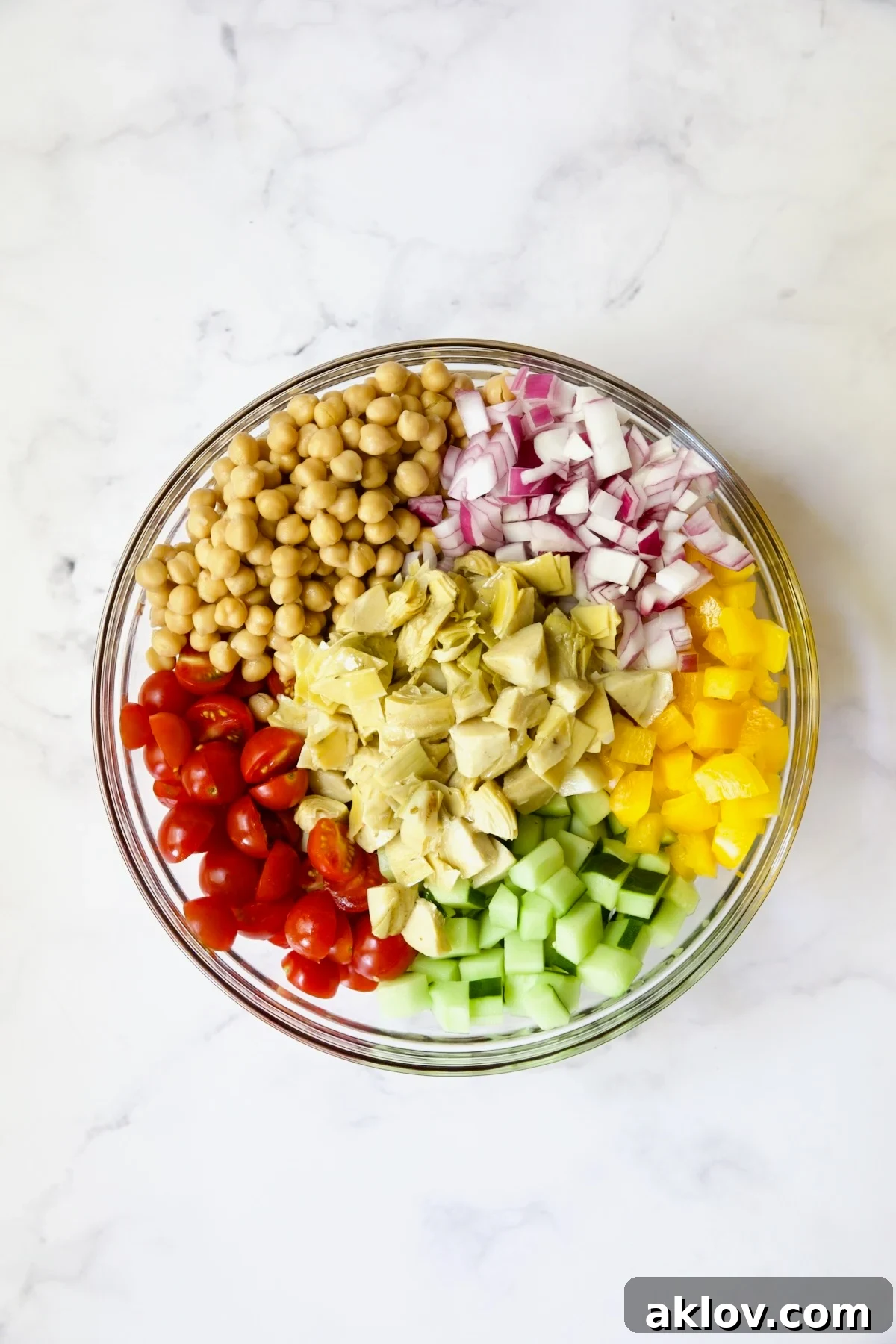 Ingredients for the salad in glass bowl before being combined.