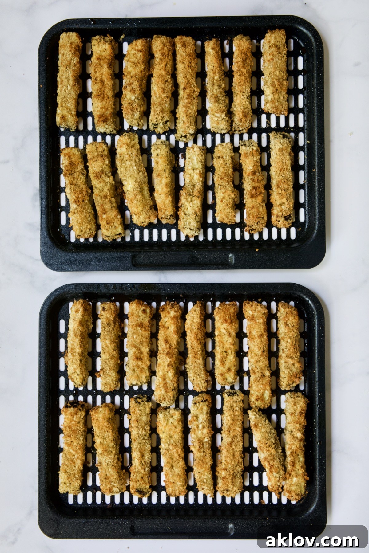 Two trays of finished eggplant fries.