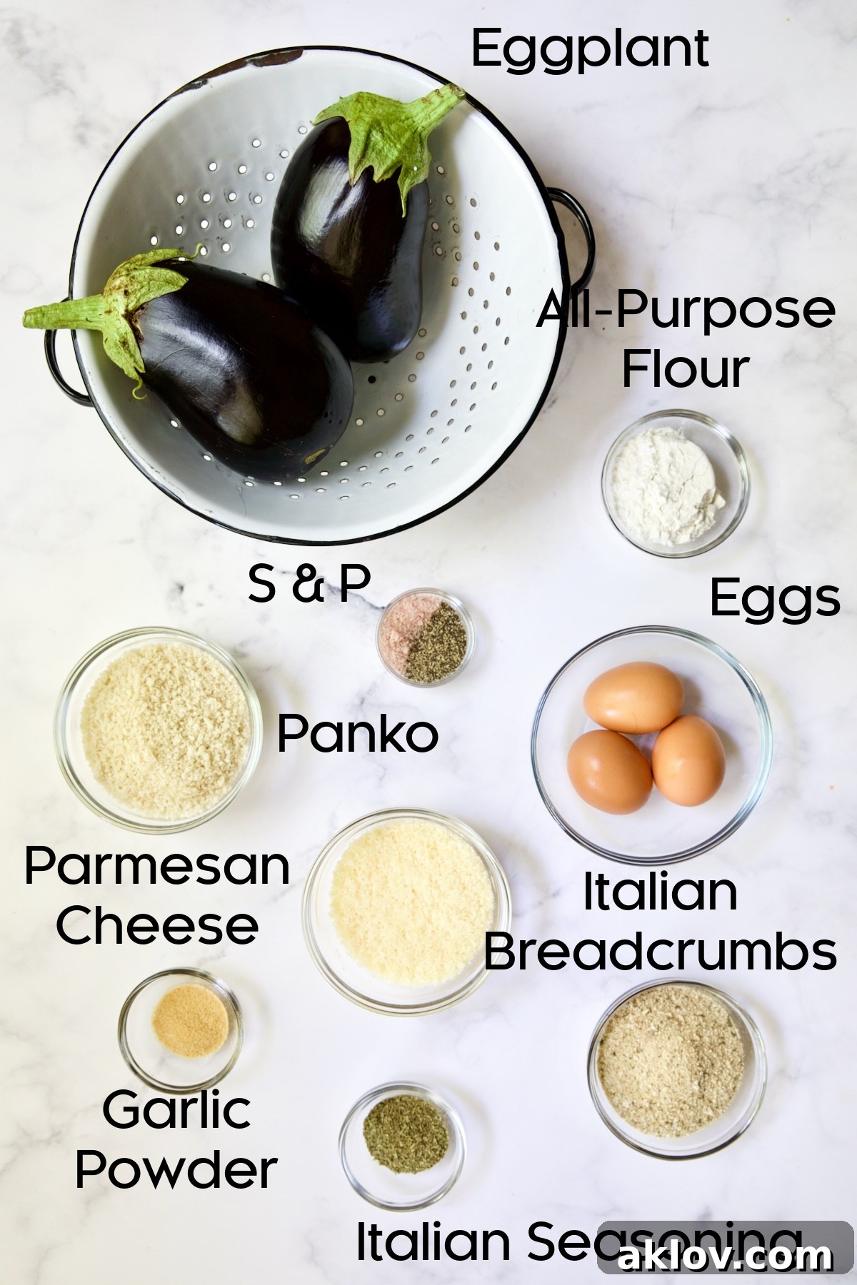 Ingredients for Air Fryer Eggplant Fries on white marble background.