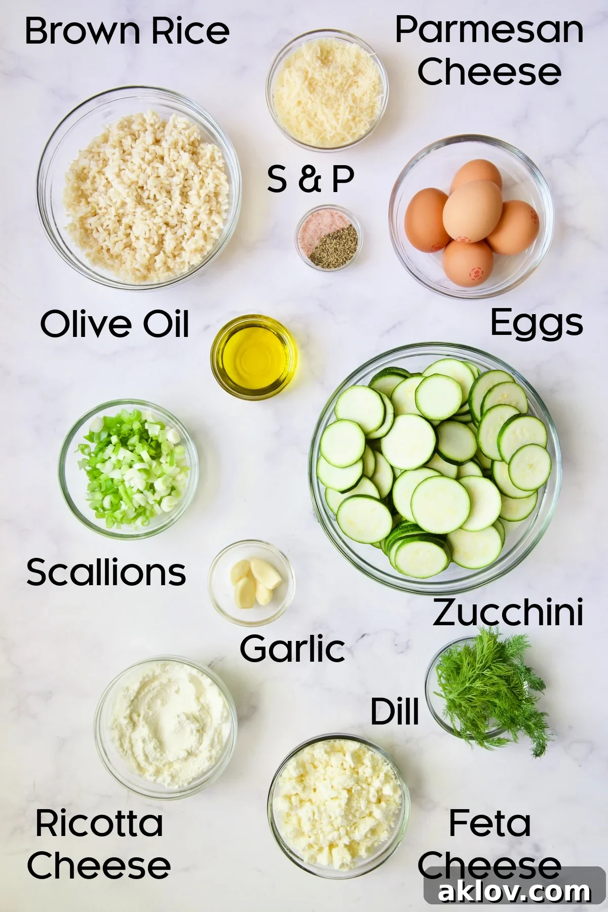Ingredients for Zucchini Pie with Feta Cheese in glass bowls.