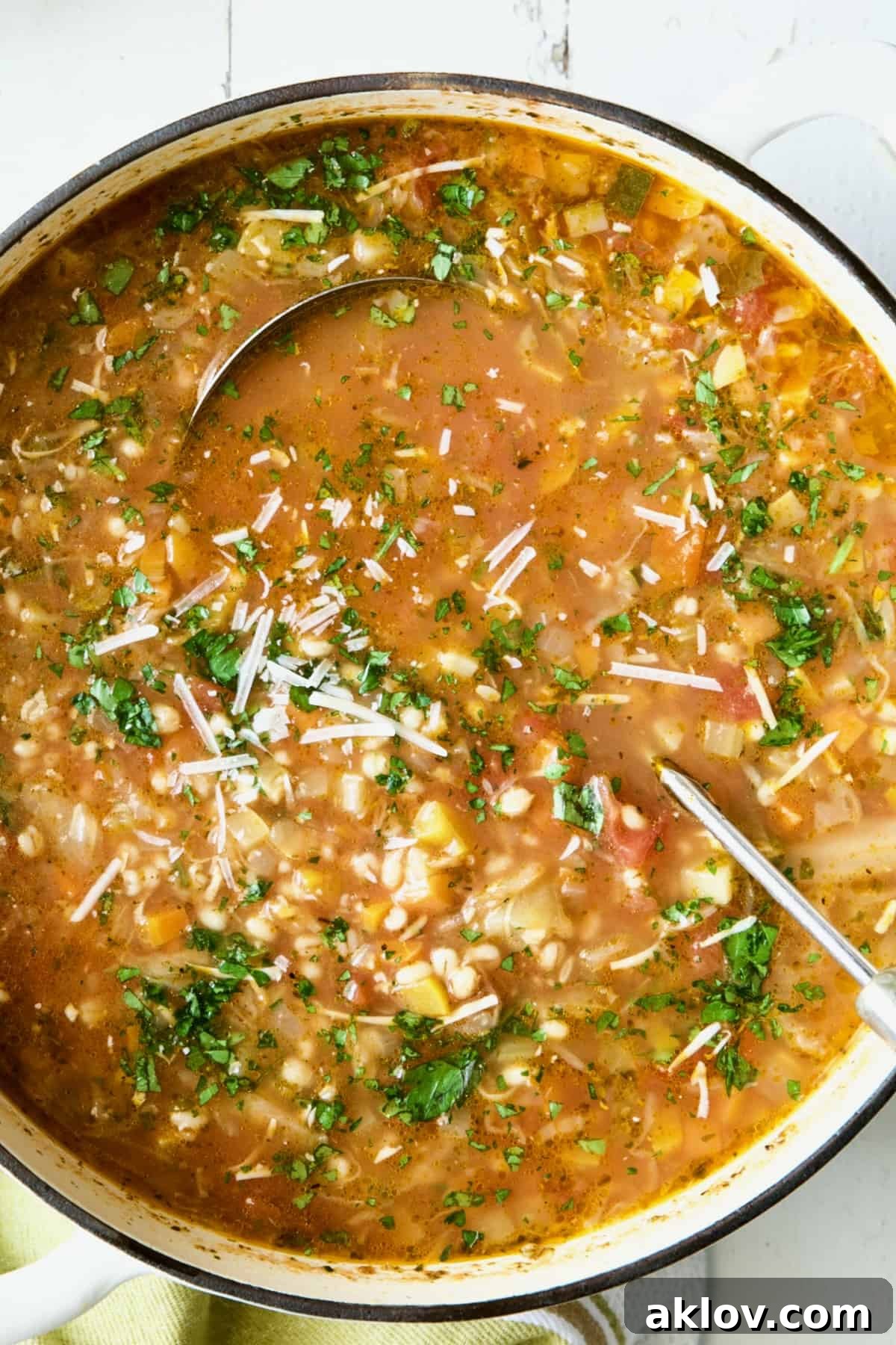 Vegetable Barley Soup in white Dutch oven.