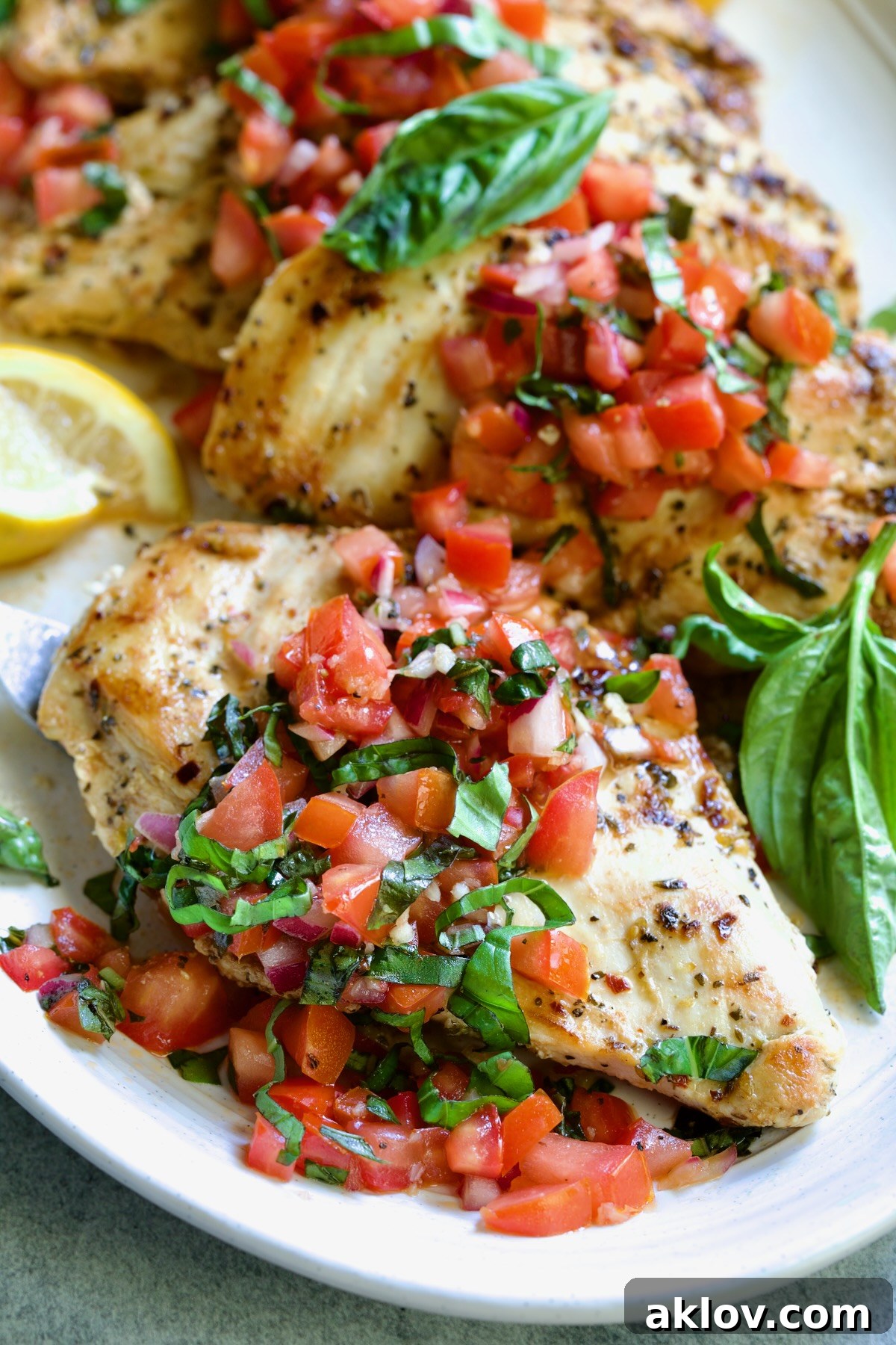 Chicken Bruschetta on oval white platter.
