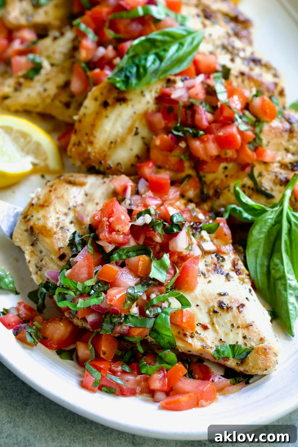 Chicken Bruschetta on oval white platter.