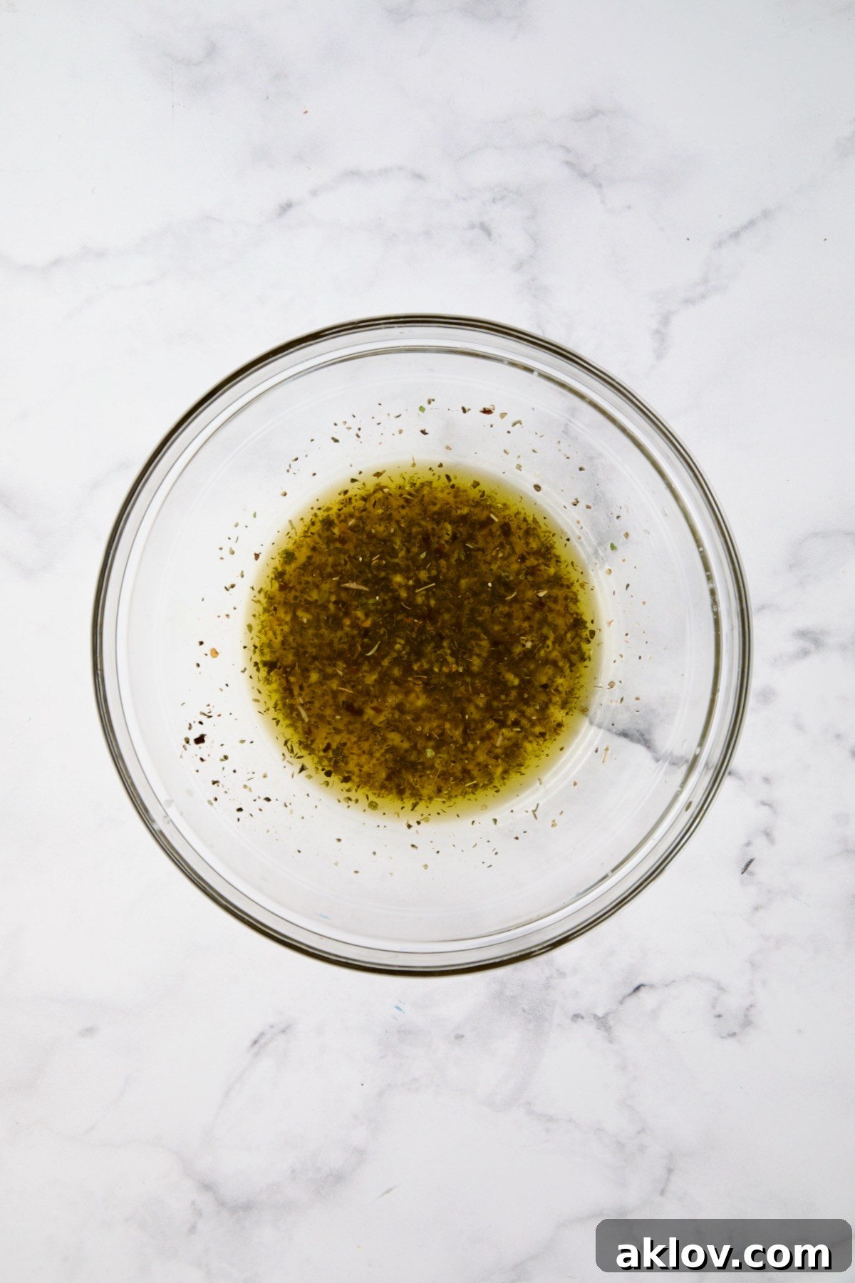Marinade for Chicken Bruschetta in glass bowl.