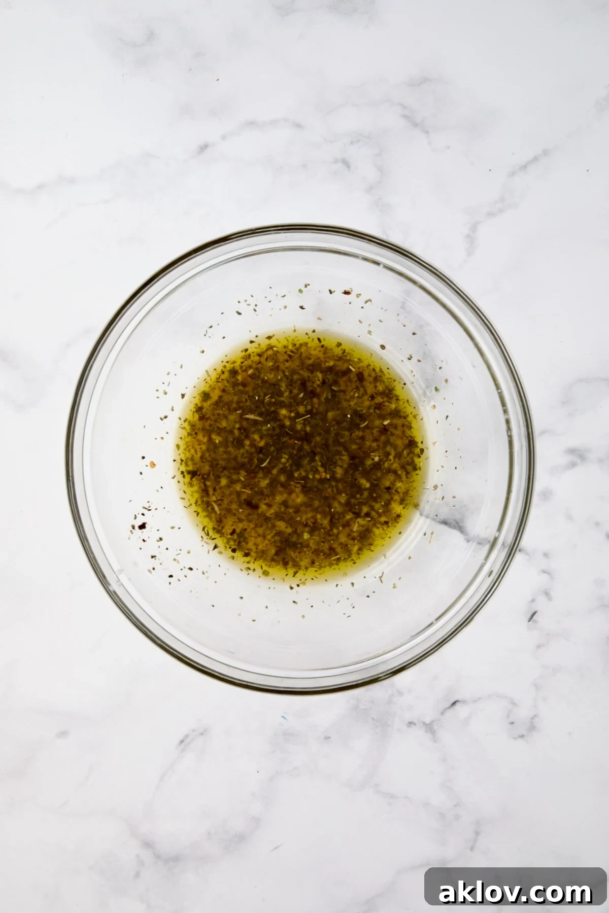 Marinade for Chicken Bruschetta in glass bowl.