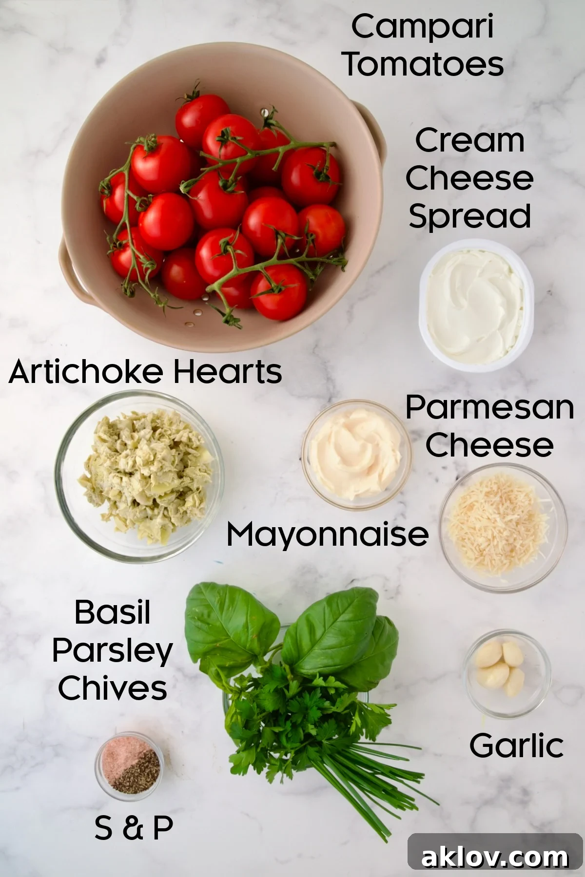 Ingredients for Cream Cheese and Artichoke Stuffed Tomatoes in glass bowls.