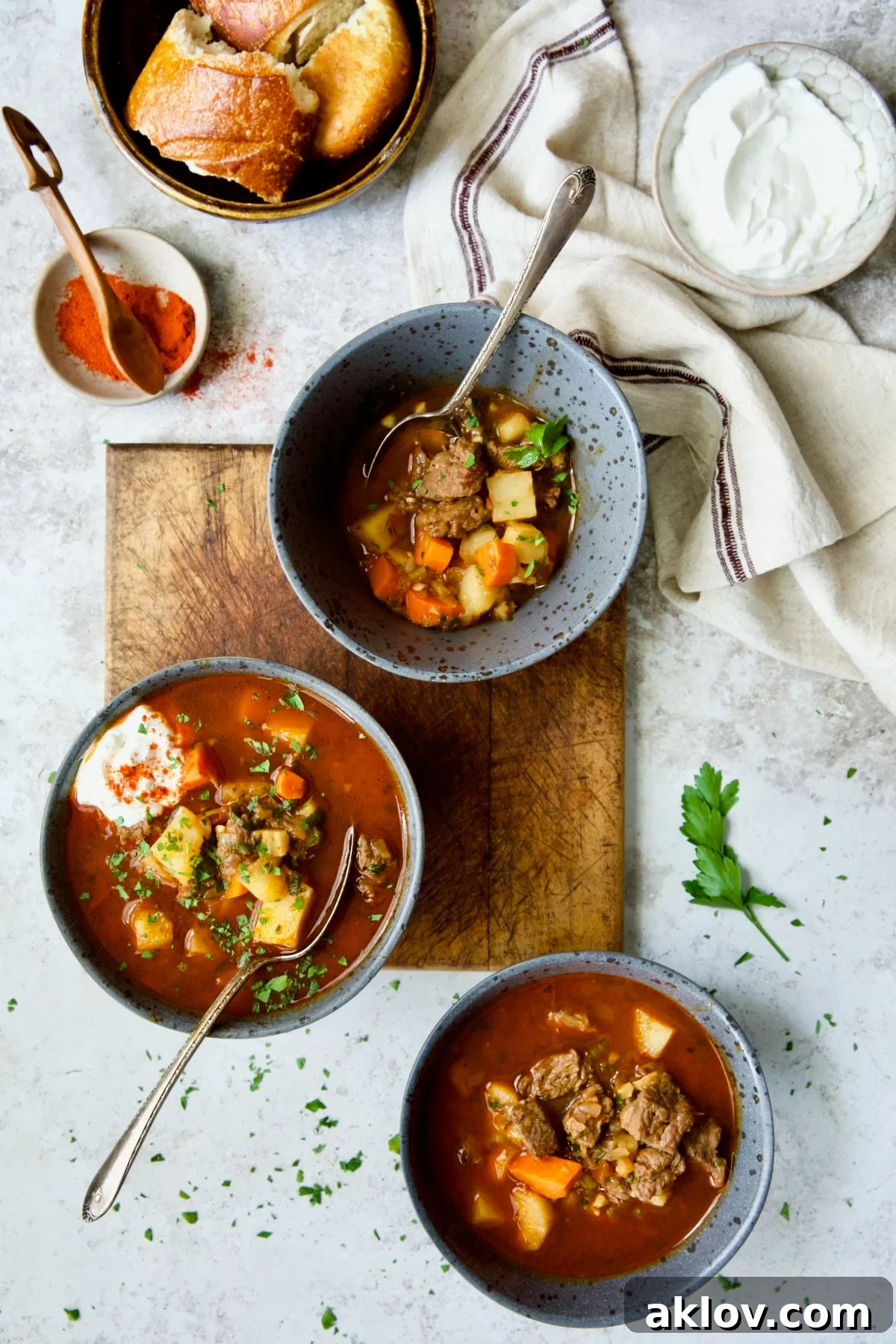 Three bowls of Traditional Hungarian Goulash Soup Recipe.