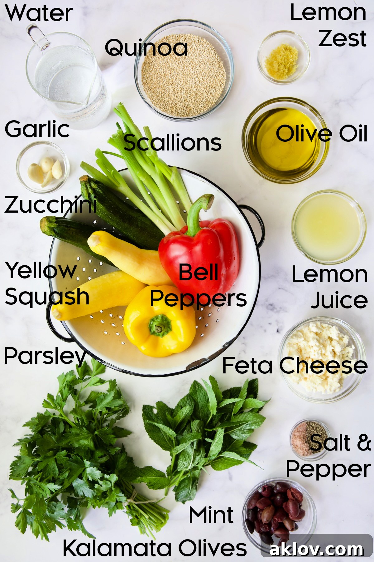 A collection of fresh ingredients for Mediterranean Quinoa Salad with Grilled Vegetables, neatly arranged in glass bowls and on a cutting board, ready for preparation.