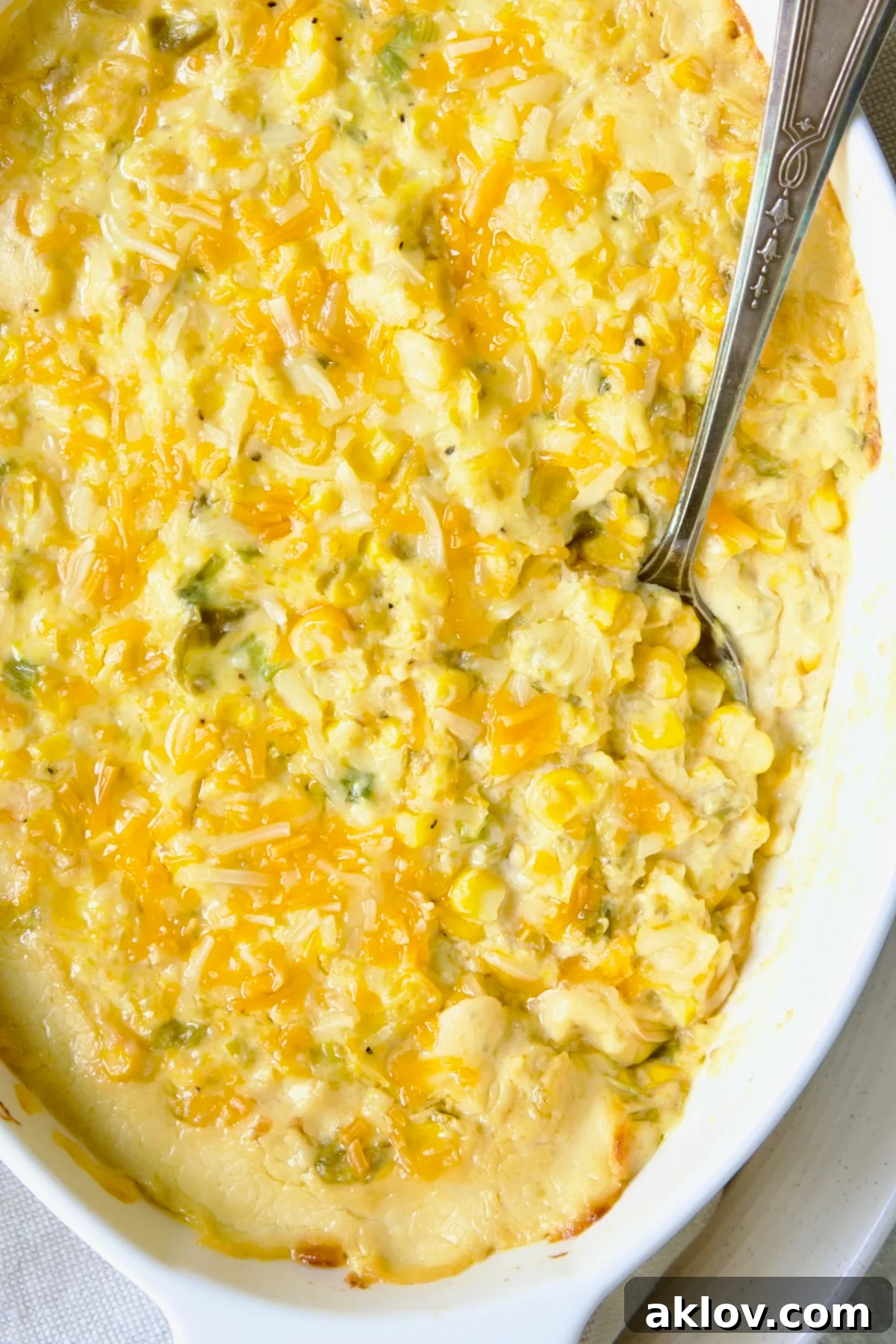 Close-up of the delicious Cream Cheese Corn Casserole, showcasing its creamy texture and golden cheesy topping.