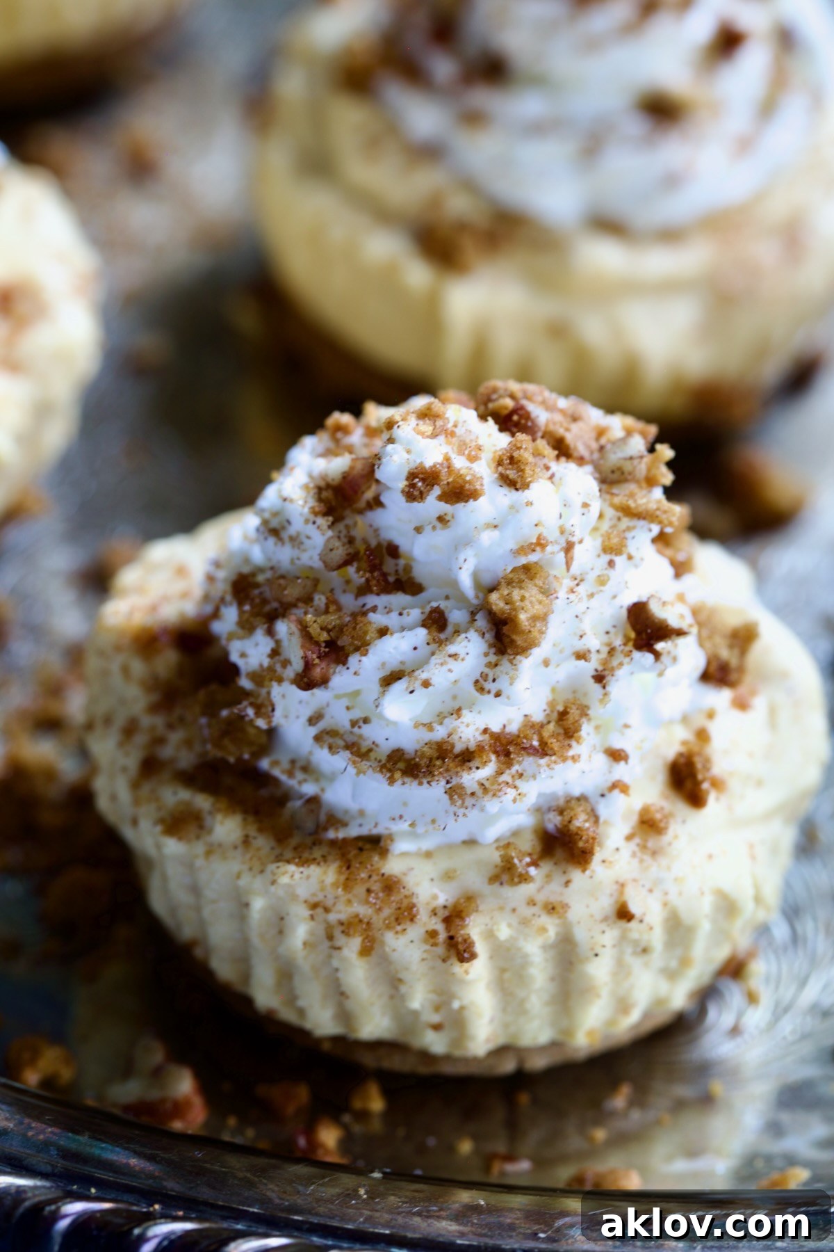 No-Bake Fall Pumpkin Cheesecake Bites 17 One Easy Mini No-Bake Pumpkin Cheesecake on a silver platter, showcasing its flawless finish.