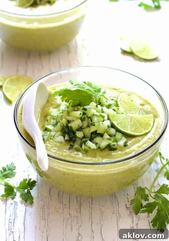 Cold Thai Cucumber Avocado Soup with Cucumber Relish in a glass bowl, ready to serve.