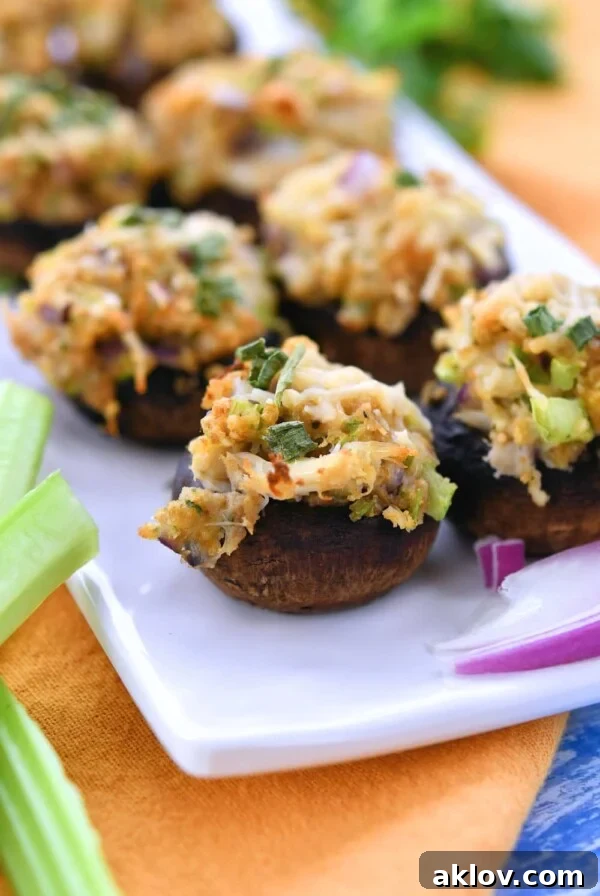 Crab-Stuffed Mushrooms on white rectangular plate.