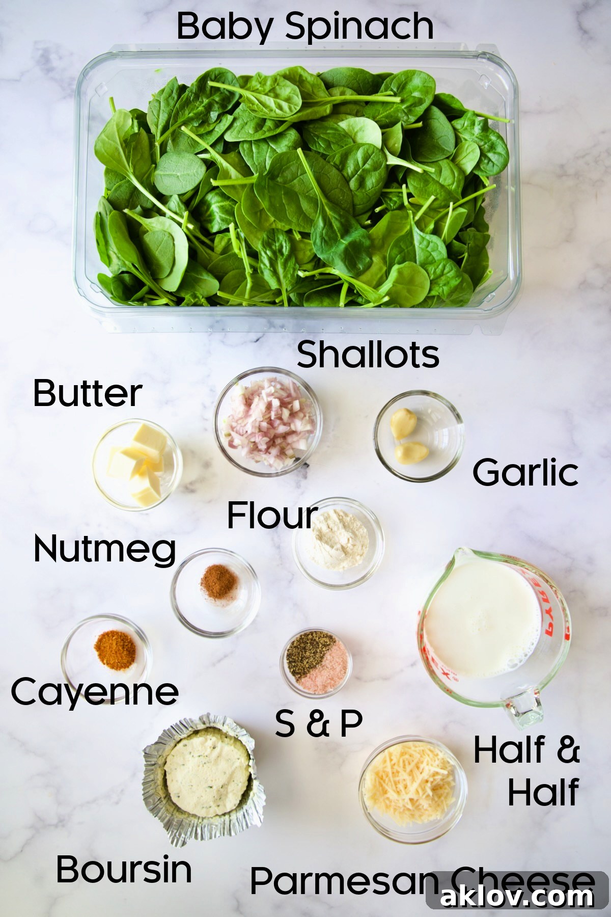 A collection of ingredients for Steakhouse Creamed Spinach arranged in glass bowls.