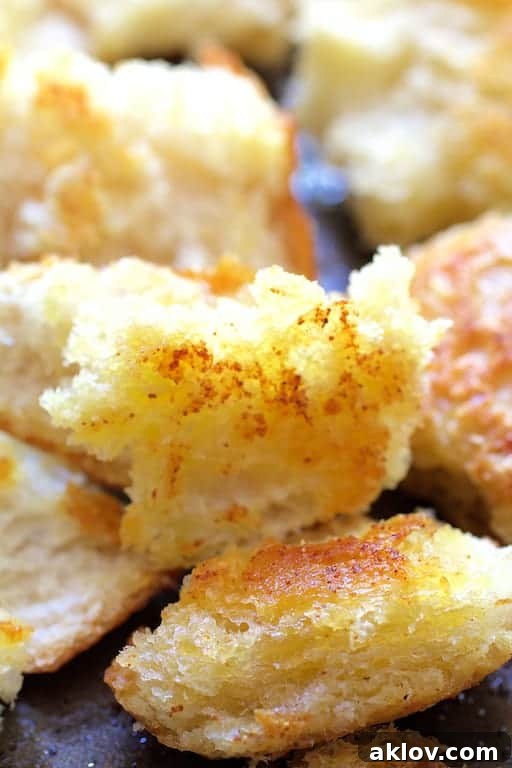 Perfectly baked golden sourdough croutons, crisp and ready to add texture to any salad.