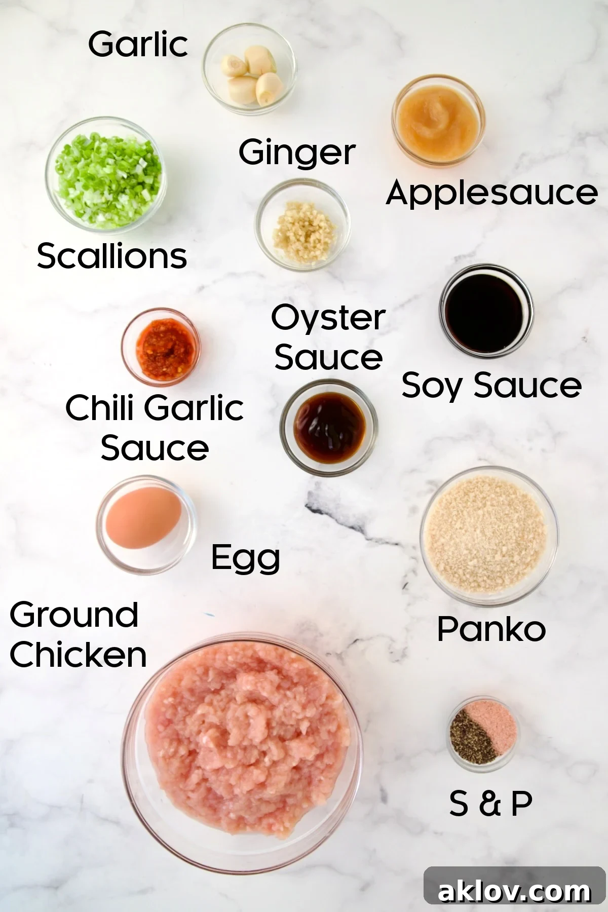 Various ingredients for Asian Chicken Meatballs laid out in glass bowls.