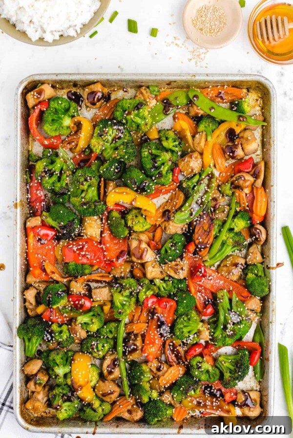 Cooked stir-fry on a sheet pan, showcasing a vibrant and healthy sheet pan chicken stir fry.