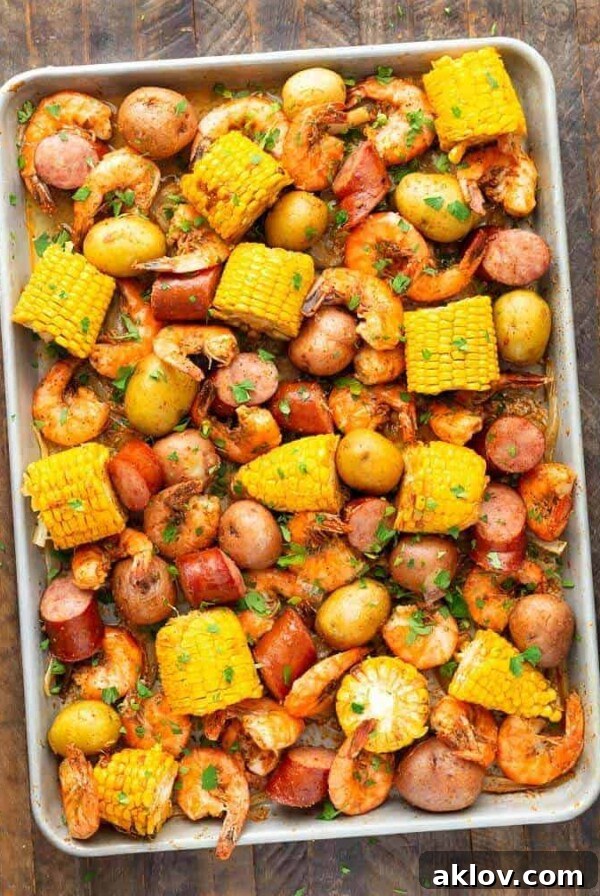 Sheet pan shrimp boil with corn, potatoes, and sausage.