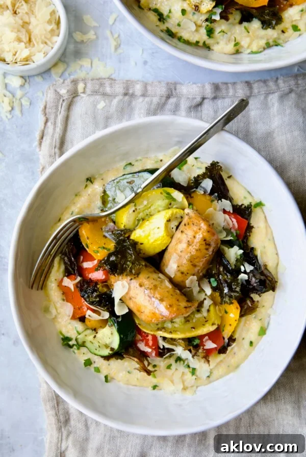 Chicken Sausage Sheet Pan and Polenta in white bowl with fork.
