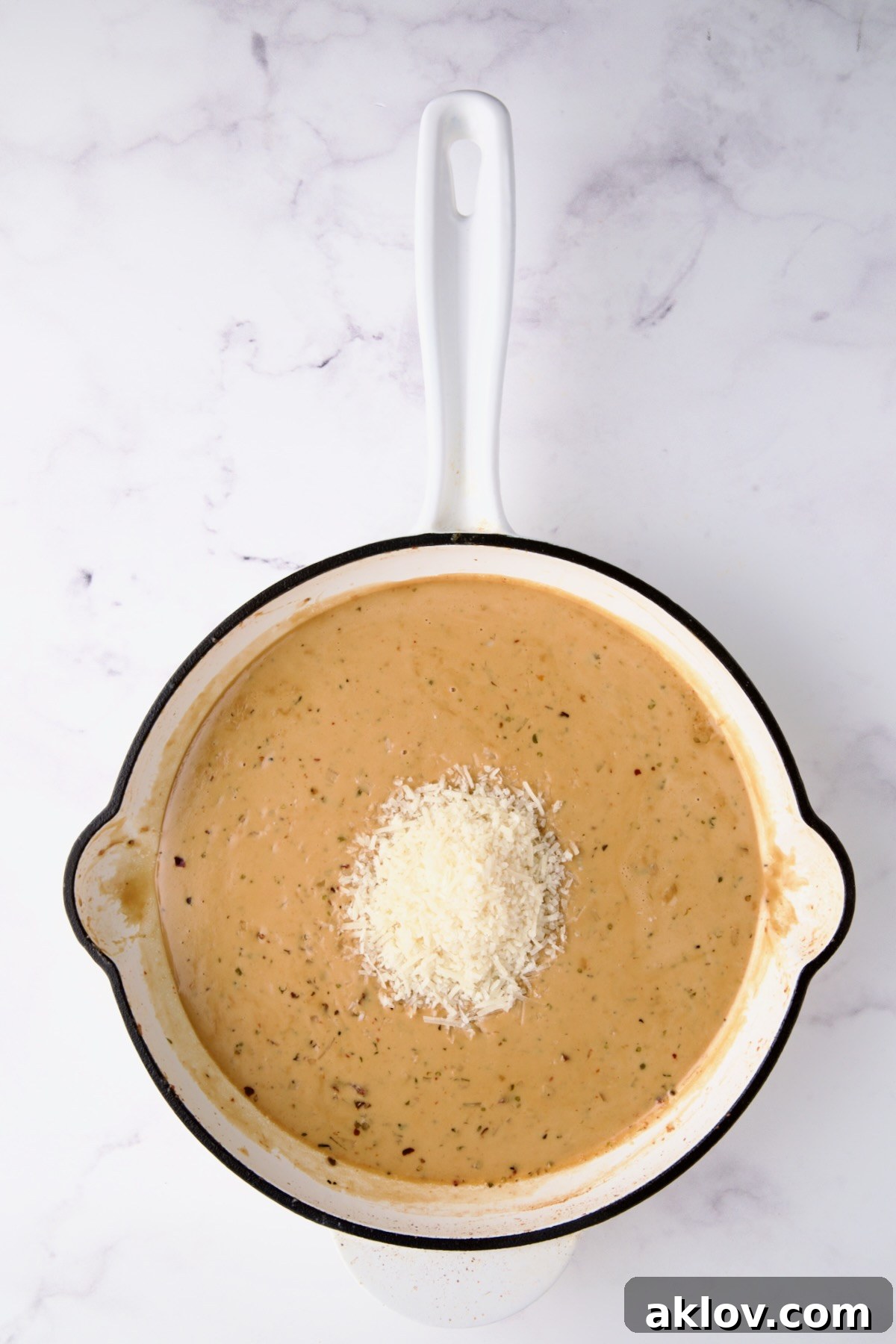 Cooked sauce with Parmesan cheese added.