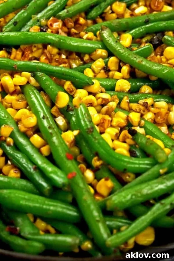Corn and green beans in cast iron skillet.