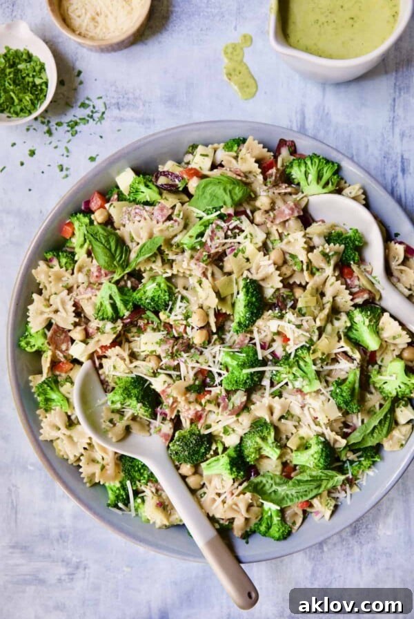 Close-up photo of Antipasto Pasta Broccoli Salad with Parmesan Herb Vinaigrette, perfect for barbecues and picnics.