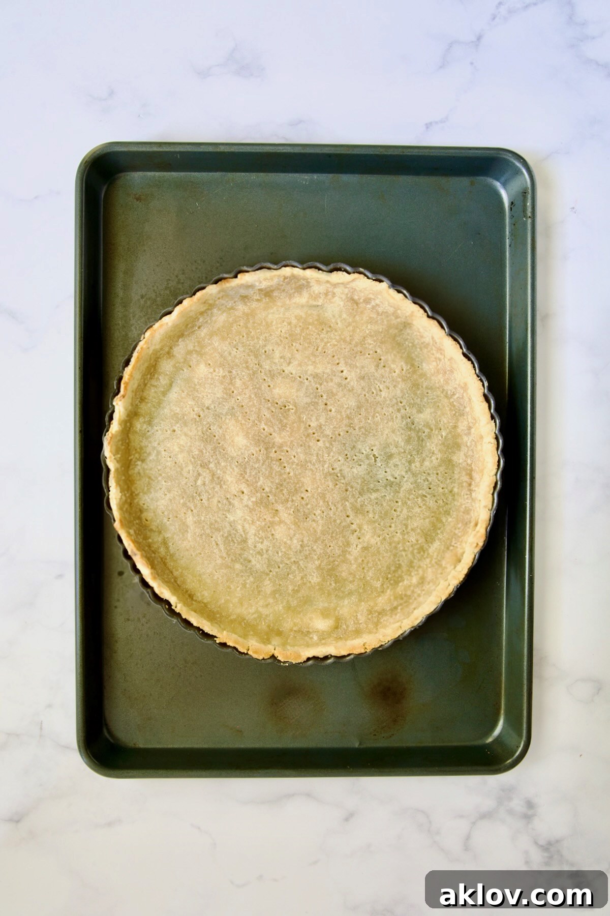 Baked tart crust on rimmed sheet pan.